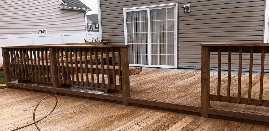 Deck sealing service protecting a backyard wood deck and railings in Myrtle Beach, SC
