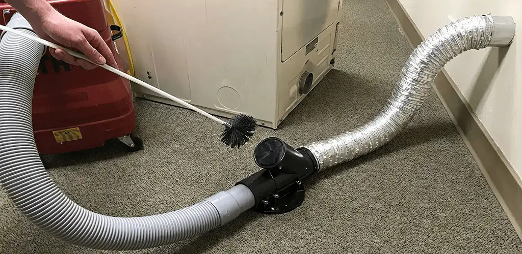 Dryer vent cleaning service removing lint from a dryer duct connection in Myrtle Beach, SC