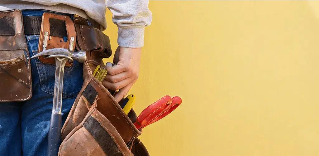Handyman with tool belt ready for home repairs and maintenance in Myrtle Beach, SC