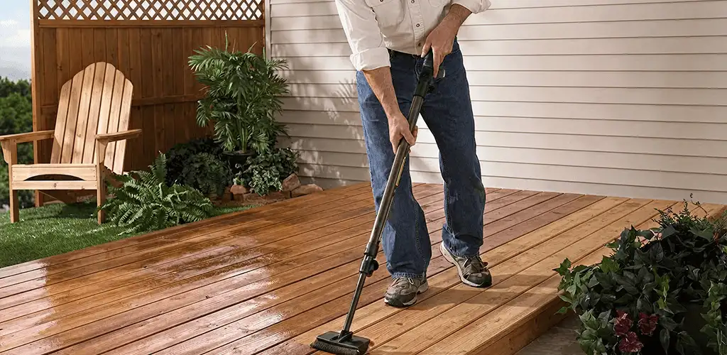 Deck staining service applying stain to a backyard wood deck in Myrtle Beach, SC